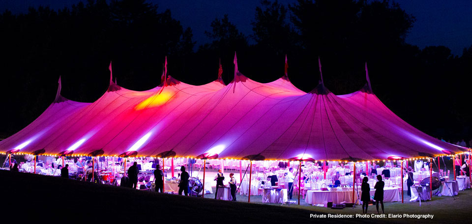 Beautiful wedding reception under a tent by Mazzone Catering at a private residence